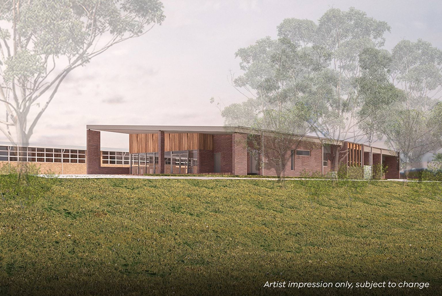 Manchester Primary School - illustrated render showing the outside of a school building surrounded by grass and trees