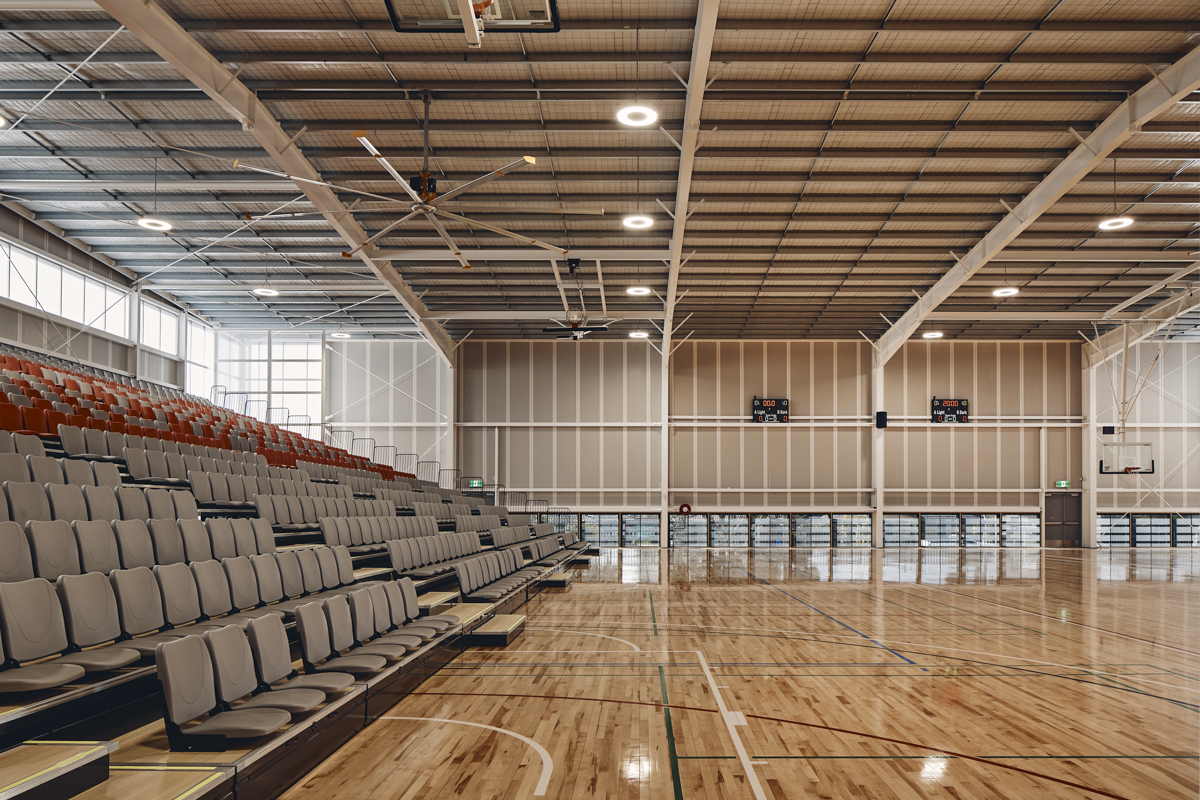 Cranbourne Secondary College - photo of a double-court indoor gymnasium and spectator seating