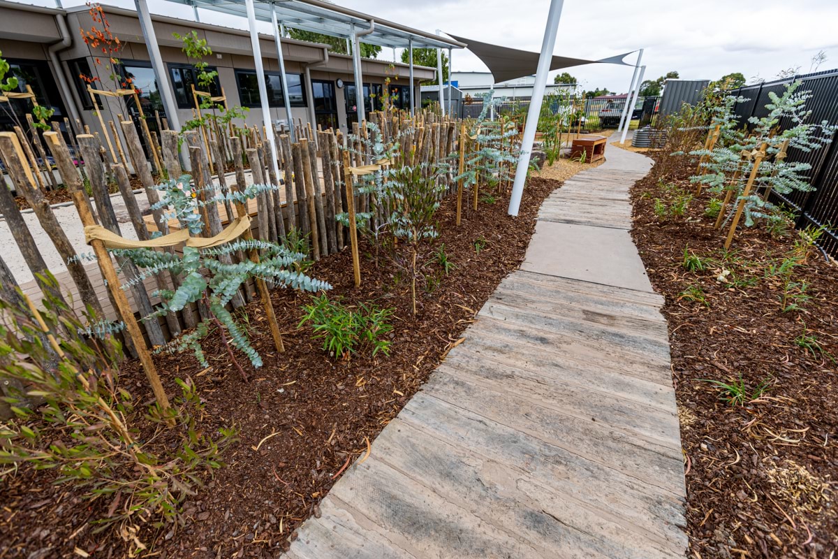 Movelle Kindergarten - photo of a walkway through a landscaped playground area