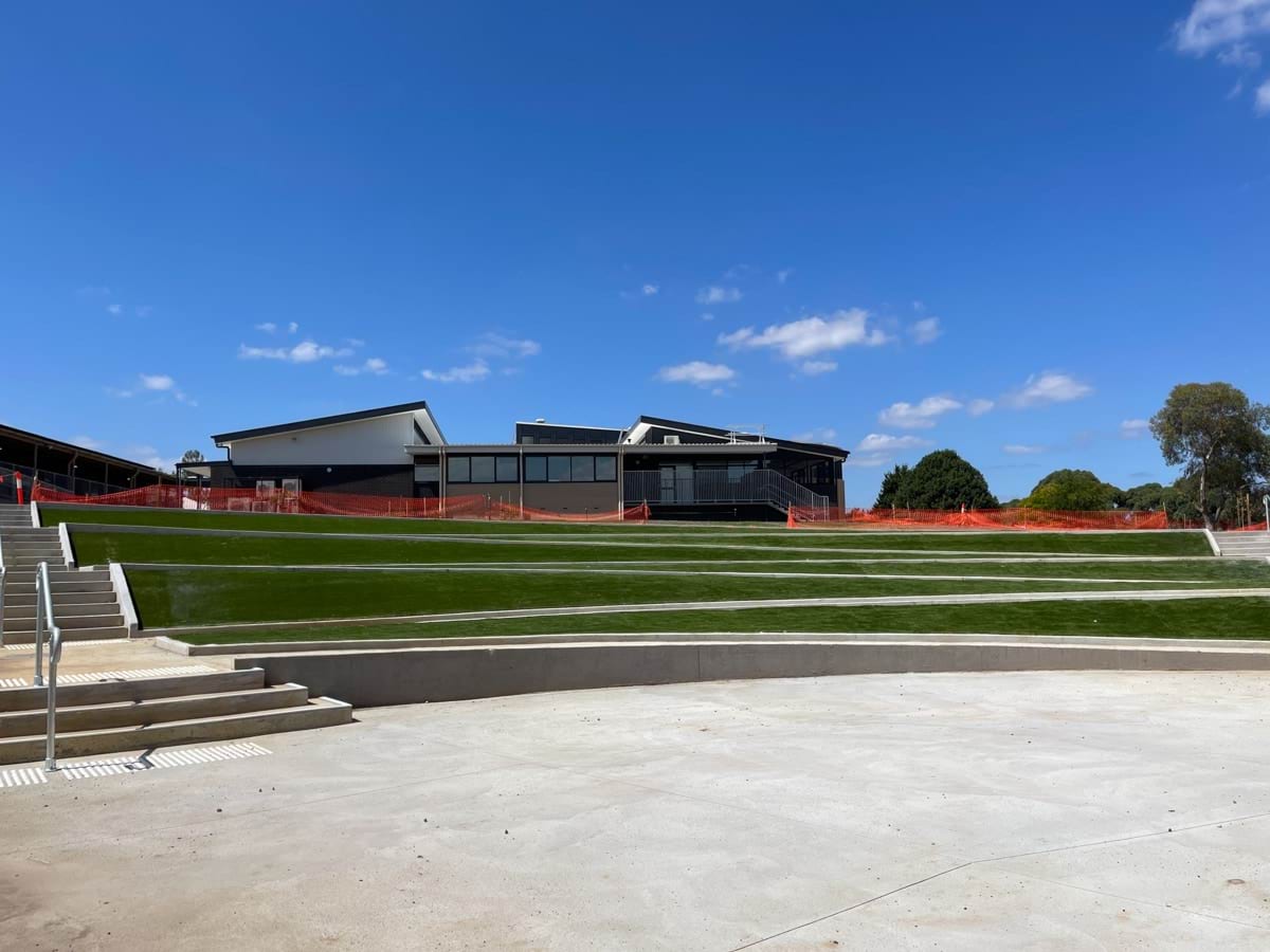 Warragul Regional College - photo showing steps landscaped into a green space in front of a new school building