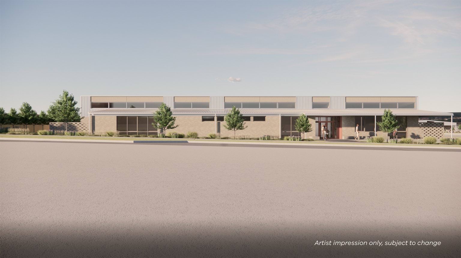 Render of kinder building. It is a light-coloured brick building in front of road.