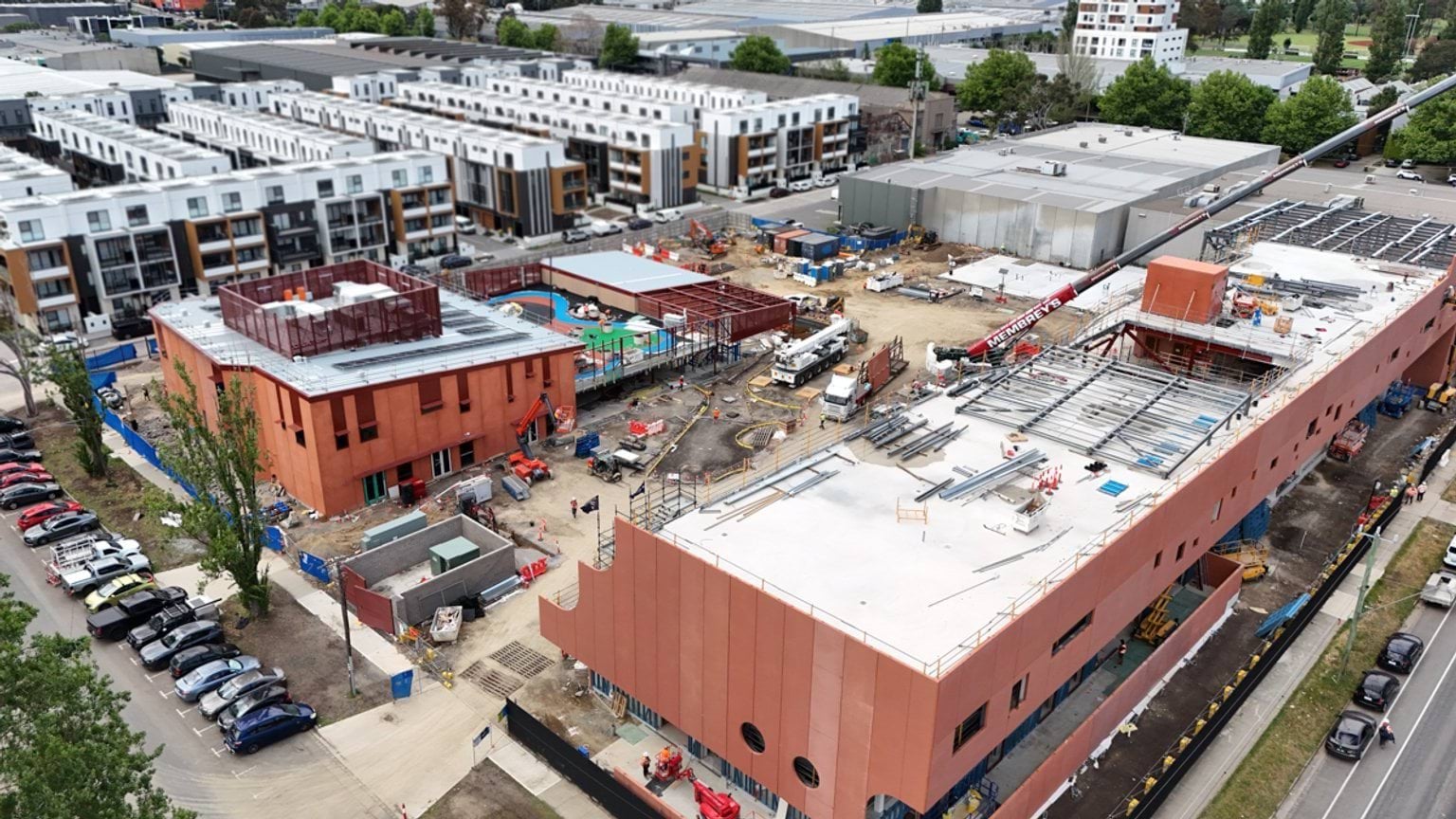 Aerial photograph of Narrarrang Primary School Kindergarten site. Striking red exterior walls and stepped levels of wall feature. 