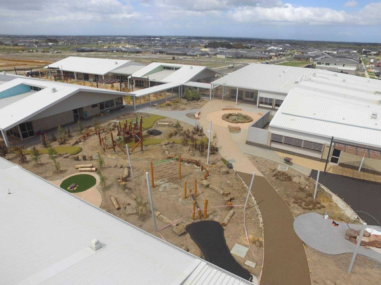 An overhead photo of Balambalam Primary School, showing an outdoor area surrounded by buildings.