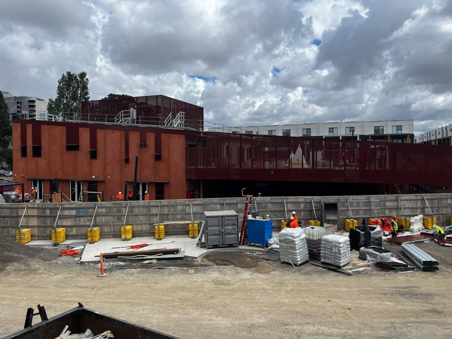 View of kindergarten from over the side of construction wall
