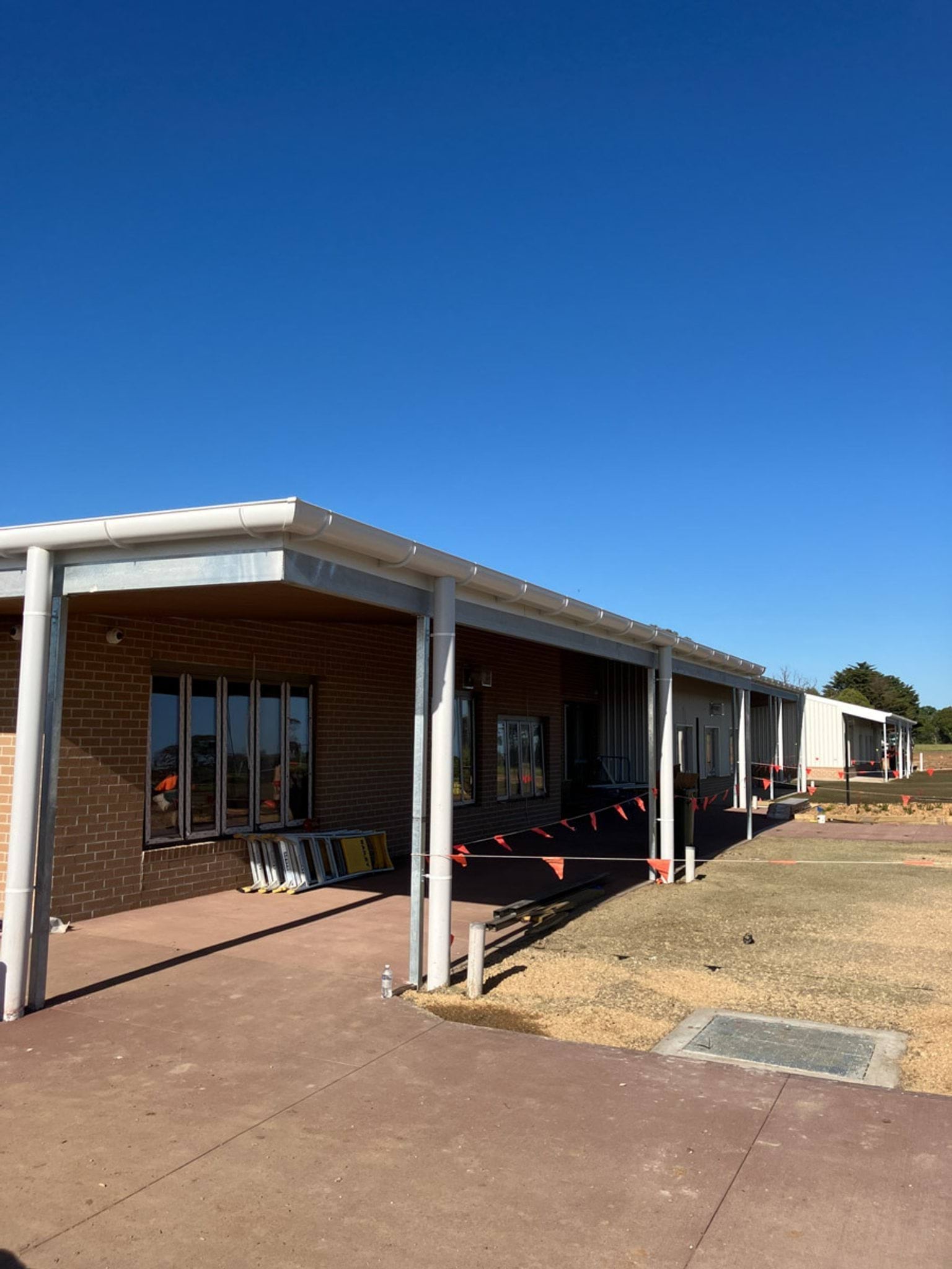 Lowset school building surrounded by construction tape