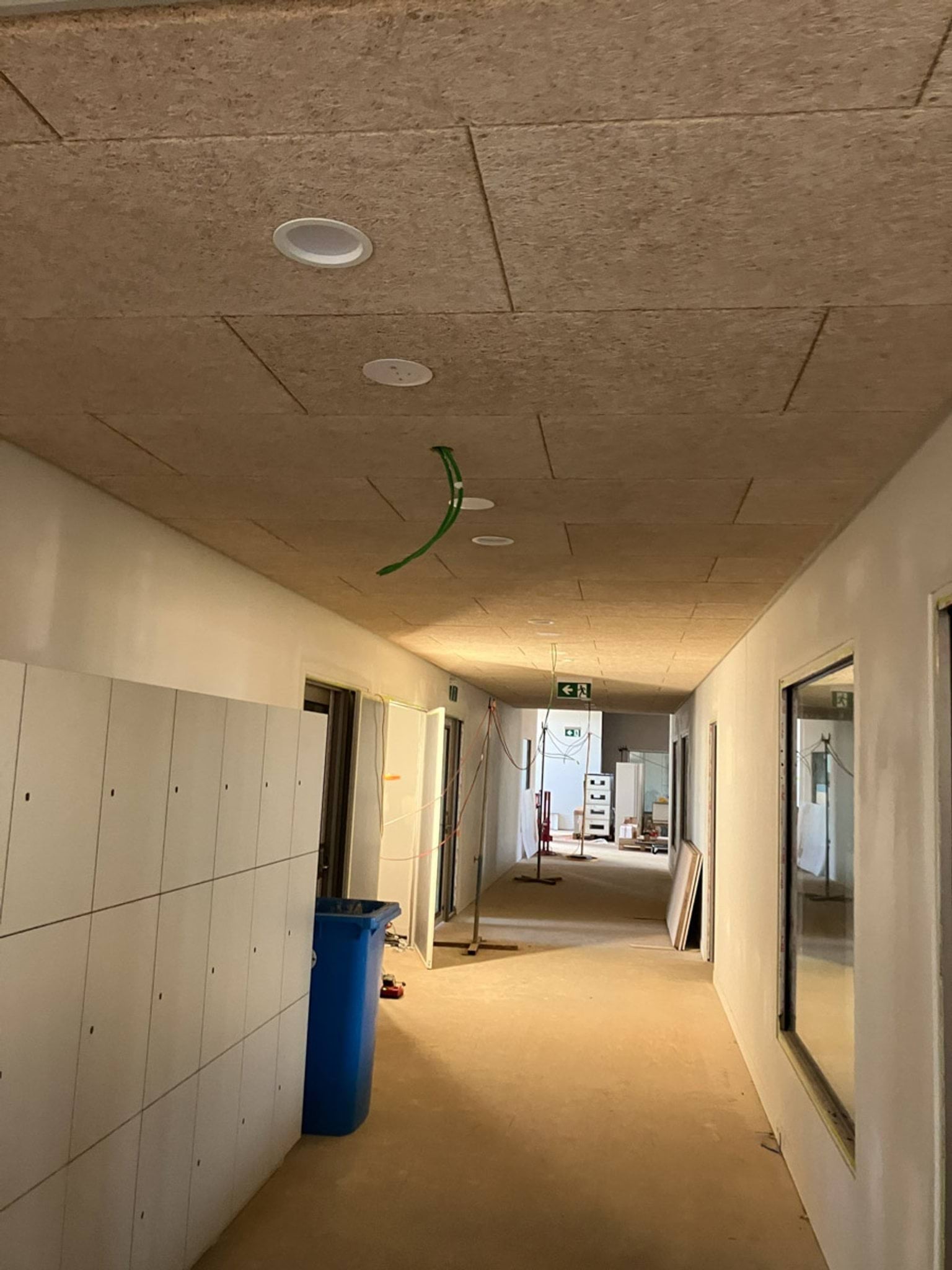 Indoor hallway with lockers off to the side