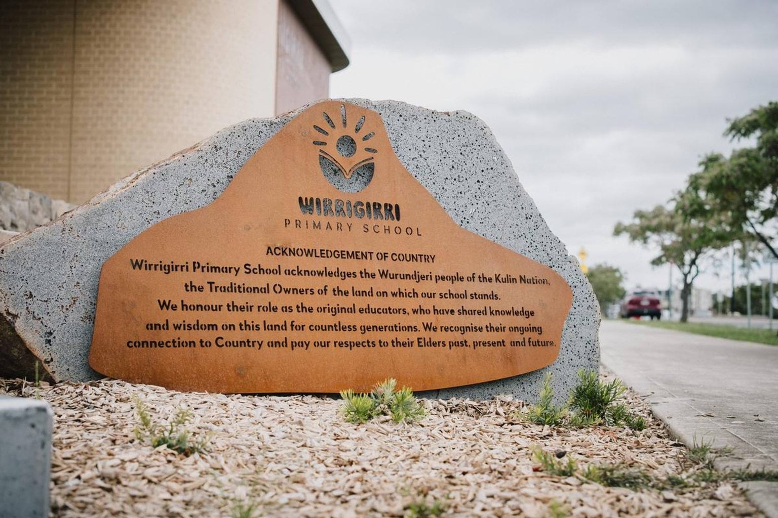 Acknowledgement of Country plaque at Wirrigirri Primary School with engraved text honouring the Wurundjeri people and their connection to Country