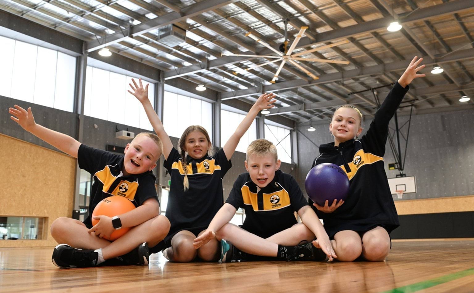 Taking part in an energetic ball‑skills session in the gym
