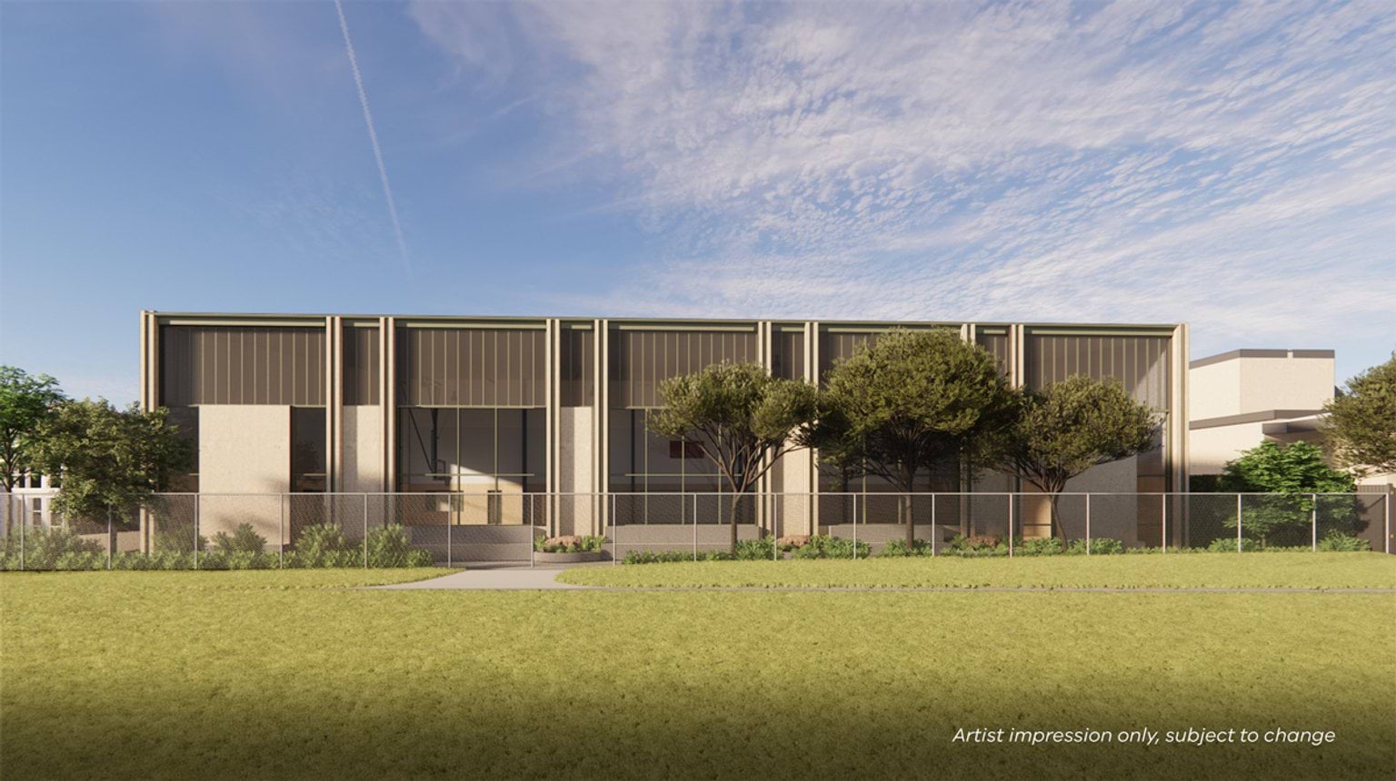 Artist impression of a school gymnasium building with dark grey metal roofline and large windows. There are trees, a wire fence and a grassed space in the foreground.