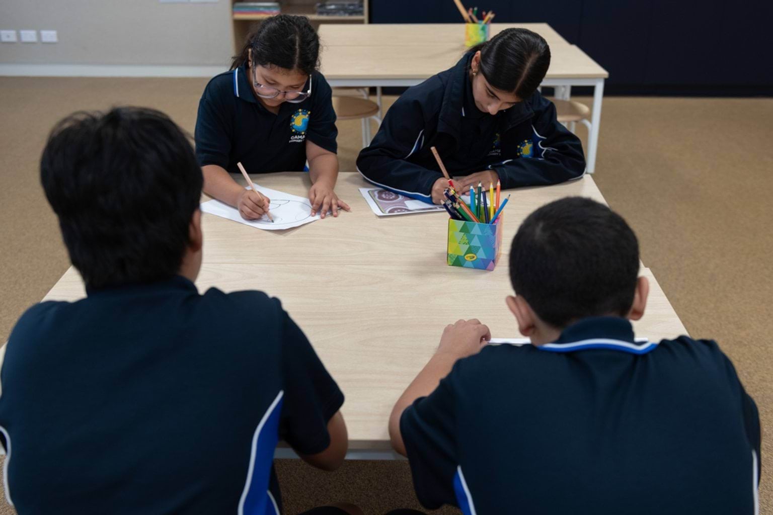 Drawing at the table during a class activity