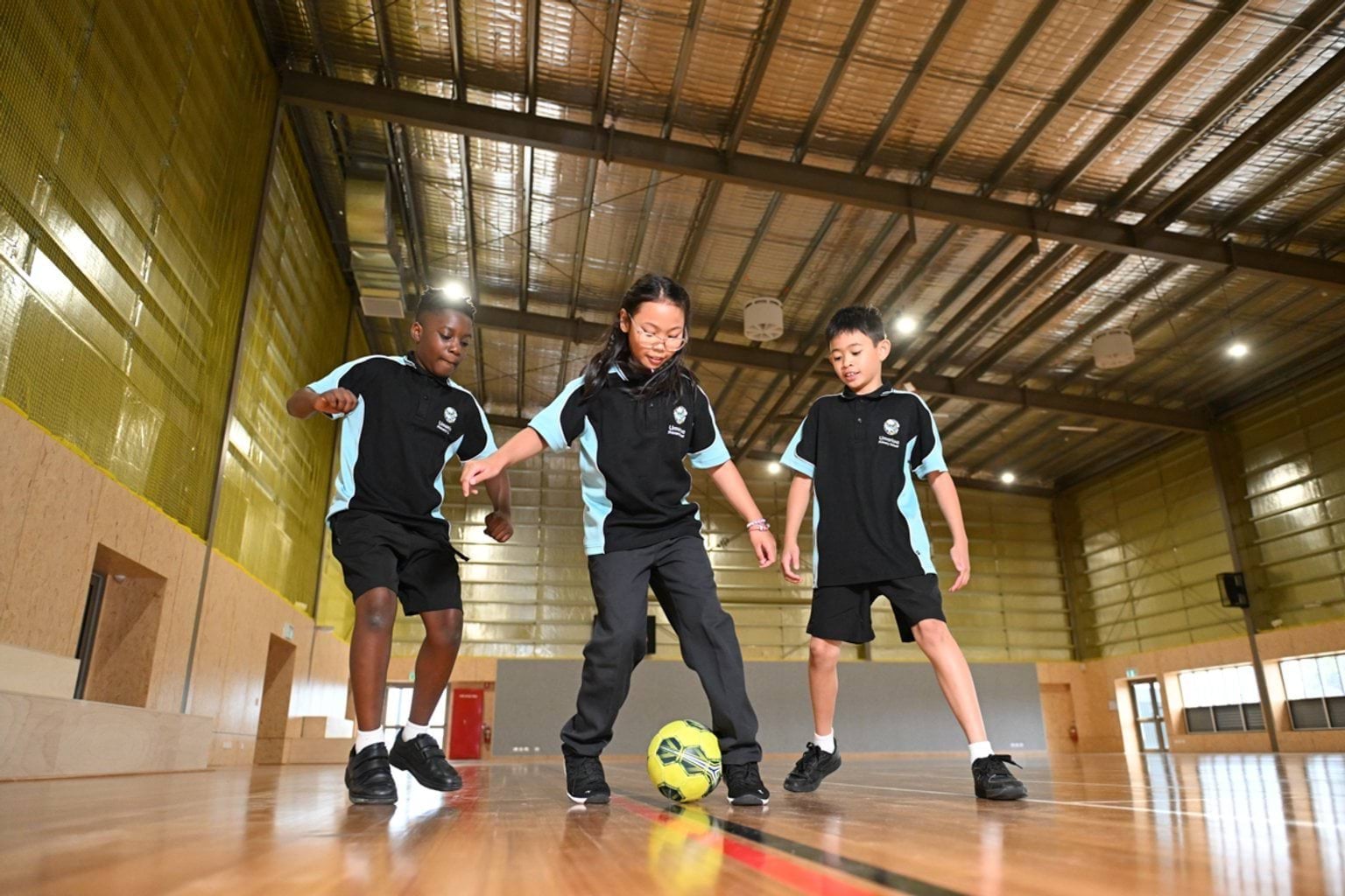 Playing with a soccer ball in the gym