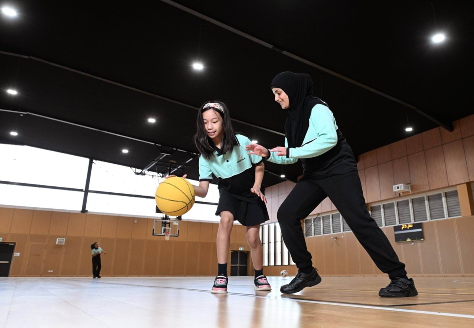 Bouncing a basketball in the gymnasium 