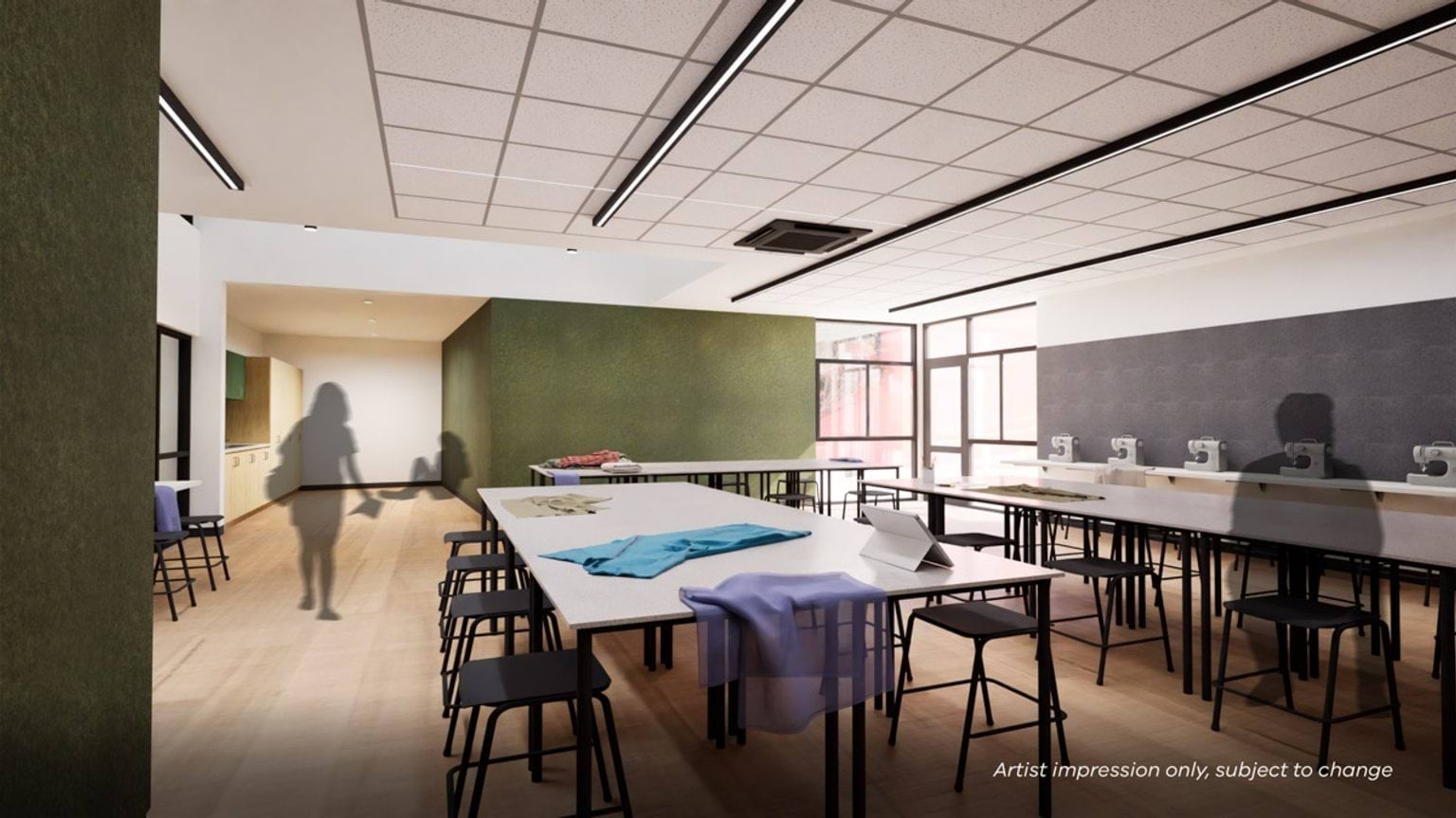 Artist’s impression of a modern textiles classroom with large worktables, sewing machines along the wall, high stools, and natural light from corner windows.
