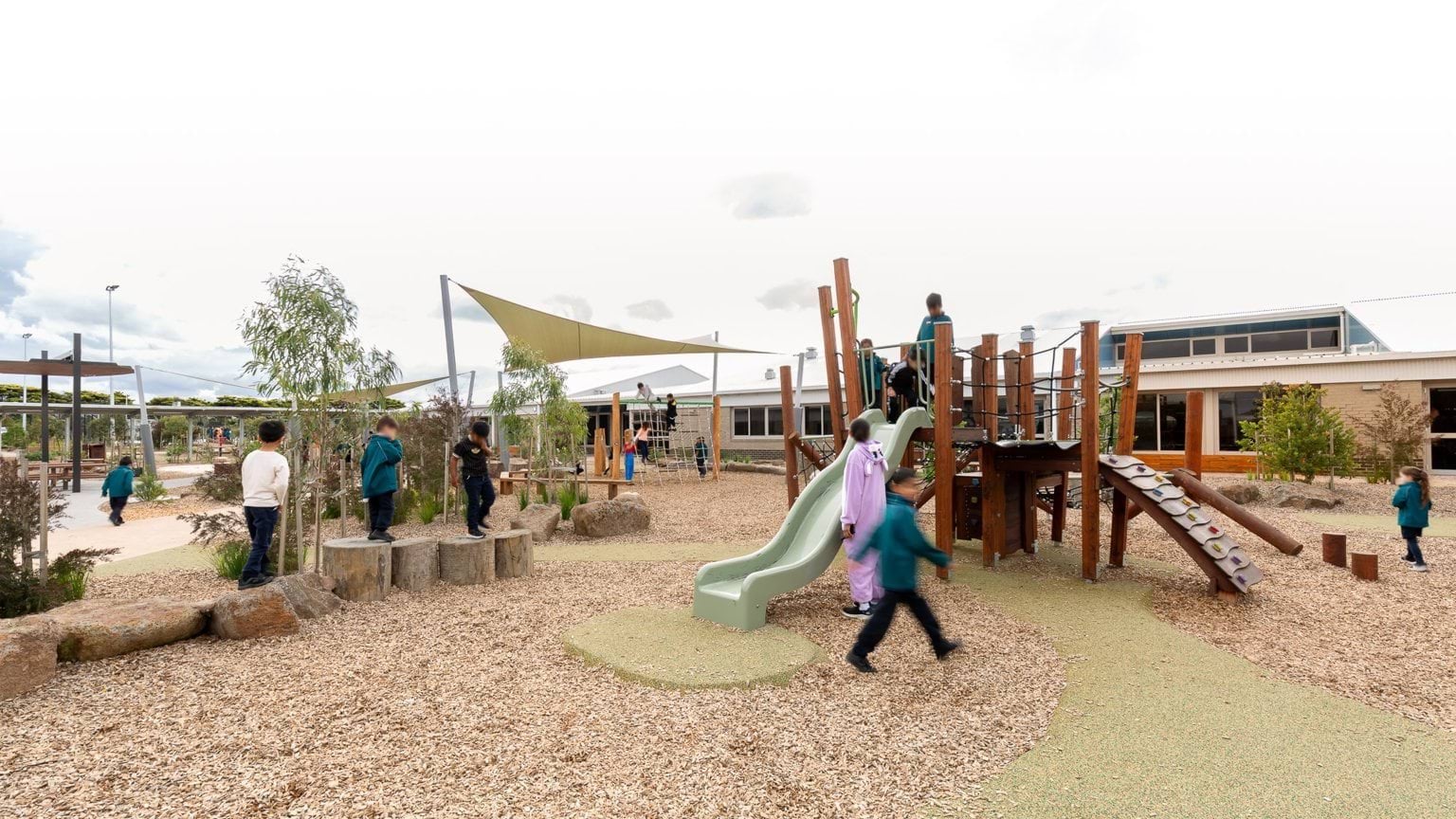 Students exploring in outdoor playground area