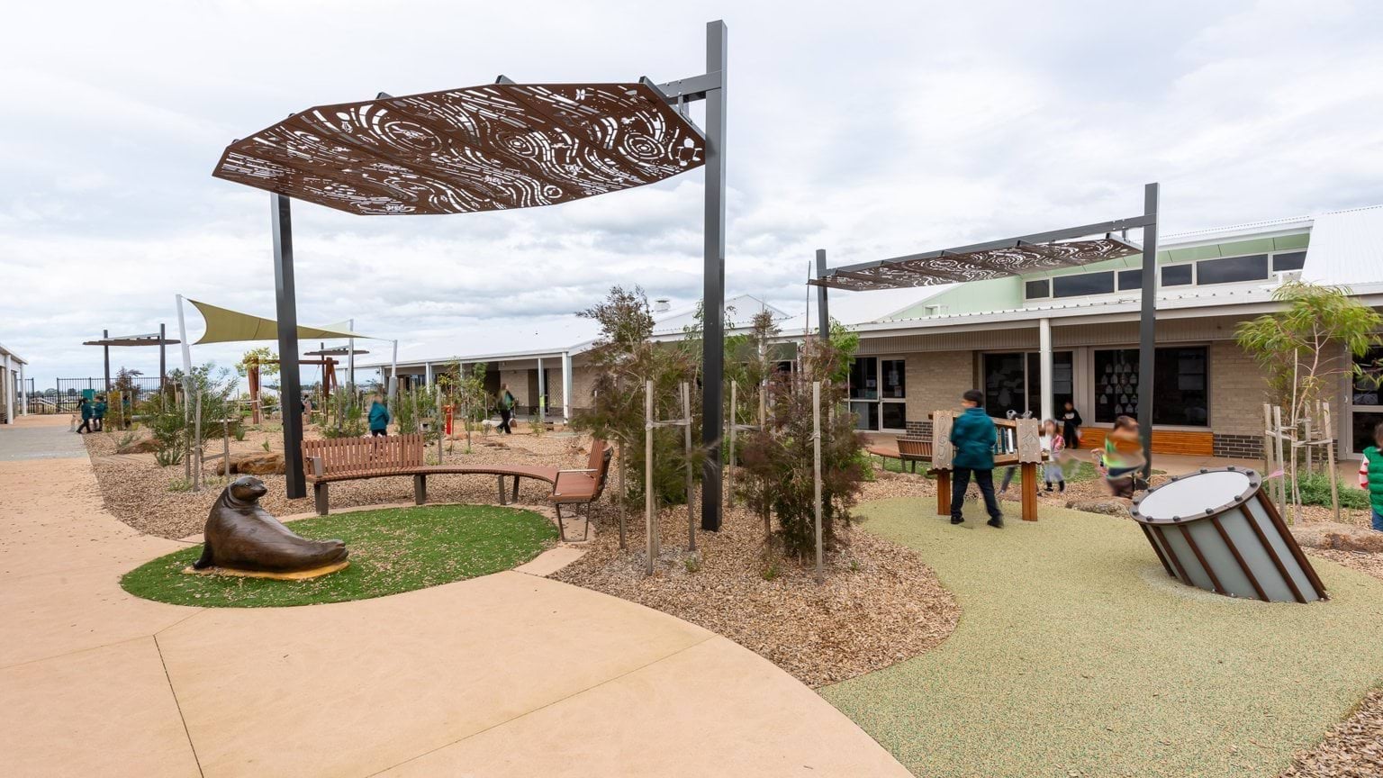 Students playing in outdoor playground area