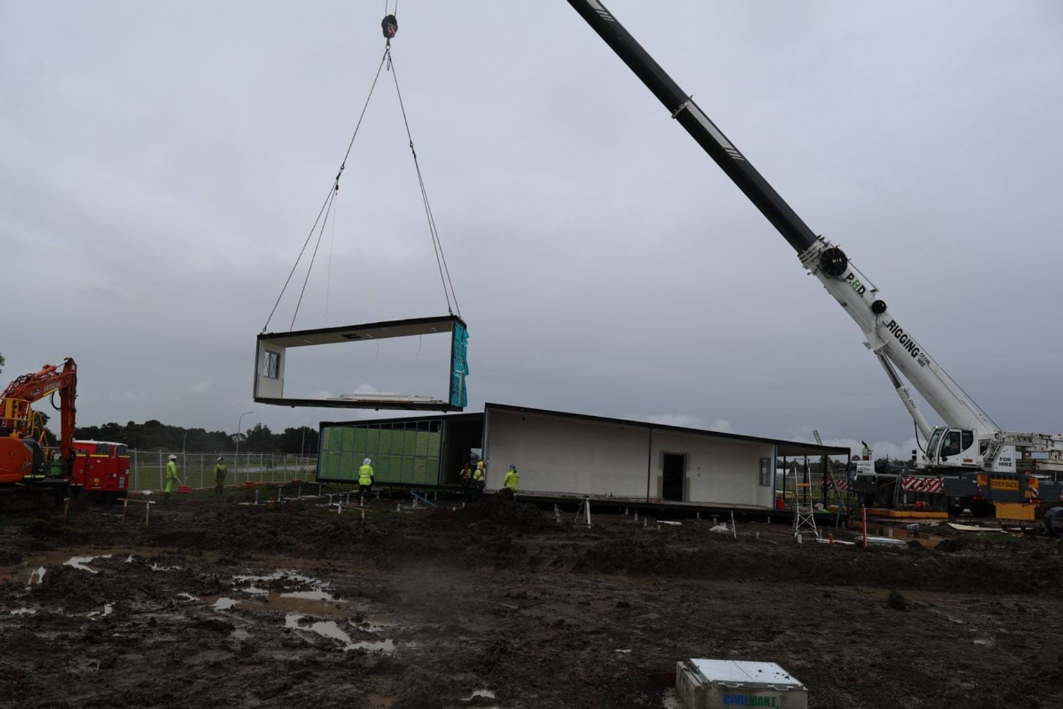 Image of crane installing modular kindergarten building