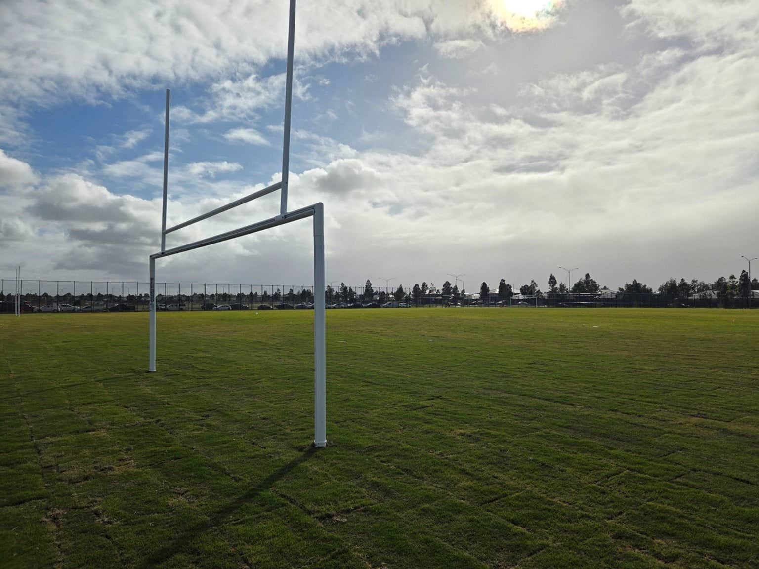Newly laid rugby field with posts